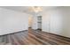 This bedroom features wood flooring, ceiling fan and a closet at 5217 Cold River Ave, Las Vegas, NV 89130