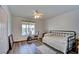 Bright bedroom featuring a ceiling fan and light, a single bed and a window view at 5217 Cold River Ave, Las Vegas, NV 89130