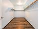 Walk-in closet with wood flooring, white walls and shelving at 5217 Cold River Ave, Las Vegas, NV 89130