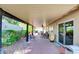 Enjoy outdoor living on this spacious covered patio with ceiling fan, mature landscaping, and sliding door access at 5217 Cold River Ave, Las Vegas, NV 89130