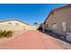 Long driveway offering ample parking space leading to the side of the house and backyard area at 5217 Cold River Ave, Las Vegas, NV 89130