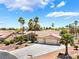 Beautiful single-story home with well-maintained landscaping and a spacious driveway leading to a two-car garage at 5217 Cold River Ave, Las Vegas, NV 89130