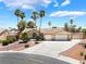 Charming single-story home with desert landscaping, tile roof, and a wide driveway leading to a two-car garage at 5217 Cold River Ave, Las Vegas, NV 89130