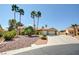 Attractive single-story home with palm trees and well-maintained gravel landscaping at 5217 Cold River Ave, Las Vegas, NV 89130