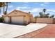 Well-maintained garage and driveway exterior with mature palm trees and desert landscaping at 5217 Cold River Ave, Las Vegas, NV 89130