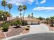 Charming single-story home with a well-manicured front yard, desert landscaping, and a spacious three-car garage at 5217 Cold River Ave, Las Vegas, NV 89130