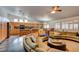 Open-concept living space with kitchen island, dining area, and Gathering room at 5217 Cold River Ave, Las Vegas, NV 89130