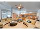 Spacious living room with a large sectional sofa and open floor plan to the kitchen and dining area at 5217 Cold River Ave, Las Vegas, NV 89130