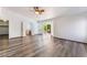 This primary bedroom boasts wood flooring, a ceiling fan, and sliding doors to the backyard at 5217 Cold River Ave, Las Vegas, NV 89130