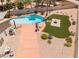 Aerial view of backyard featuring a swimming pool, artificial grass and desert landscaping at 5217 Cold River Ave, Las Vegas, NV 89130