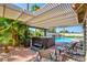 Relax in the backyard oasis featuring a hot tub, pool, mature landscaping, and seating area at 5217 Cold River Ave, Las Vegas, NV 89130