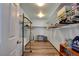 Spacious walk-in closet offering ample storage with built-in shelving and metal racks for organization at 5217 Cold River Ave, Las Vegas, NV 89130