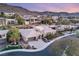 Stunning aerial view of home, showcasing mature landscaping, desert surroundings, and a convenient two car garage at 540 Regents Gate Dr, Henderson, NV 89012