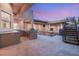 Backyard area features an outdoor kitchen with a grill, bar and stainless appliances at 540 Regents Gate Dr, Henderson, NV 89012