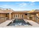 Modern backyard with pool, spa, outdoor kitchen, and stairs to an upper terrace at 540 Regents Gate Dr, Henderson, NV 89012