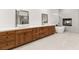 Bathroom with double vanities, a modern soaking tub, and a cozy fireplace at 540 Regents Gate Dr, Henderson, NV 89012