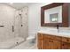 Bathroom featuring glass enclosed shower with mosaic tile, modern vanity with vessel sink and bronze fixtures at 540 Regents Gate Dr, Henderson, NV 89012