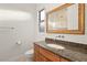 Bathroom features a granite countertop, a stylish mirror, and fixtures at 540 Regents Gate Dr, Henderson, NV 89012