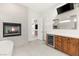 Bathroom featuring a fireplace, soaking tub, and a vanity with a beverage cooler at 540 Regents Gate Dr, Henderson, NV 89012
