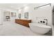 Spacious bathroom with double vanity, soaking tub, and a fireplace in the mirror's reflection at 540 Regents Gate Dr, Henderson, NV 89012