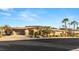 Welcoming single-story home featuring a desert landscaped yard and a convenient two-car garage with sleek glass doors at 540 Regents Gate Dr, Henderson, NV 89012