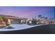 Inviting single-story home featuring a desert landscaped yard and a convenient two-car garage with sleek glass doors at 540 Regents Gate Dr, Henderson, NV 89012