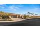 Welcoming single-story home featuring a desert landscaped yard and a convenient two-car garage with sleek glass doors at 540 Regents Gate Dr, Henderson, NV 89012