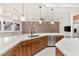 Spacious kitchen with custom wood cabinets, stainless steel appliances, and quartz countertops at 540 Regents Gate Dr, Henderson, NV 89012