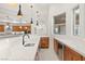 Kitchen with custom wood cabinets, quartz countertops, and built-in wine refrigerator at 540 Regents Gate Dr, Henderson, NV 89012