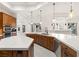 Bright kitchen features custom wood cabinetry, quartz countertops, and stainless steel appliances at 540 Regents Gate Dr, Henderson, NV 89012