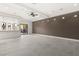 Unfurnished living room with modern lighting, neutral walls, and bright white flooring at 540 Regents Gate Dr, Henderson, NV 89012
