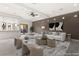 Staged living room featuring modern decor, recessed lighting, and a neutral color palette at 540 Regents Gate Dr, Henderson, NV 89012