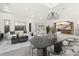 Staged living room with white walls, staircase, and comfortable seating area at 540 Regents Gate Dr, Henderson, NV 89012