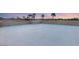 Expansive roof deck offering ample space for outdoor living and entertaining with views of palm trees and sunset at 540 Regents Gate Dr, Henderson, NV 89012