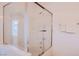 Bright bathroom featuring a shower-over-tub, clear glass screen and chrome fixtures at 5415 W Harmon Ave # 1119, Las Vegas, NV 89103