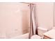 Bathroom featuring a toilet and a shower over tub with curtain at 5415 W Harmon Ave # 1119, Las Vegas, NV 89103