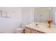 Bathroom featuring a toilet, and single sink vanity with neutral countertop at 5415 W Harmon Ave # 1119, Las Vegas, NV 89103