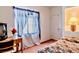 Cozy bedroom featuring floral bedding, desk and built-in shelving unit at 5415 W Harmon Ave # 1119, Las Vegas, NV 89103