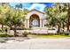 Opulence Condos complex featuring lush landscaping and a welcoming entrance at 5415 W Harmon Ave # 1119, Las Vegas, NV 89103
