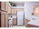 Efficient kitchen design with white appliances and bright countertops at 5415 W Harmon Ave # 1119, Las Vegas, NV 89103