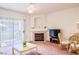 Bright living room with sliding glass door, fireplace, and comfortable seating area at 5415 W Harmon Ave # 1119, Las Vegas, NV 89103