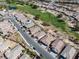 Aerial view of homes lining the golf course of a Primary-planned community at 5675 E La Campana Dr, Pahrump, NV 89061
