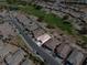 Aerial view of homes near a golf course surrounded by desert vegetation at 5675 E La Campana Dr, Pahrump, NV 89061