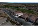 Community aerial shot of a single-story home on a tree-lined street near a golf course at 5675 E La Campana Dr, Pahrump, NV 89061