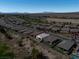 Bird's-eye view of homes in a desert community surrounded by arid landscape and mountain views at 5675 E La Campana Dr, Pahrump, NV 89061