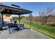 Private backyard featuring a gazebo with a seating area, string lights, and manicured lawn at 5675 E La Campana Dr, Pahrump, NV 89061