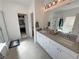 Well-lit bathroom featuring dual sinks, bright cabinetry, and a separate shower and tub at 5675 E La Campana Dr, Pahrump, NV 89061