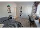 Well-lit bedroom features a desk and shelving near the closet with sliding doors at 5675 E La Campana Dr, Pahrump, NV 89061