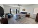 Spacious bedroom featuring a cozy sitting area, plush carpeting, and a ceiling fan at 5675 E La Campana Dr, Pahrump, NV 89061