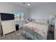 Bedroom with a window for natural light, a desk and a chest of drawers for storage at 5675 E La Campana Dr, Pahrump, NV 89061